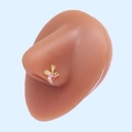 Macro shot of L-shaped gold nose stud with pink heart and wing on silicone model - Gold Cupid Pink Heart (#26)