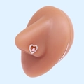 Close-up of a silver heart-shaped nose stud with a pink gemstone on a silicone model - Silver Pink Heart Gemstone (#23)