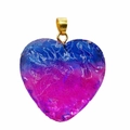 Macro shot of heart-shaped gradient crystal pendant with golden clasp on white background - Blue/Magenta