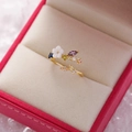 Macro detail of adjustable floral ring with multi-color zircon crystals on pink velvet - 9#14120A (Champagne Gold Five-Color Gem Branch)