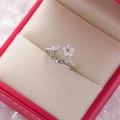 Detailed view of floral ring with resin petals and blue crystals on velvet - 14#14122B (Silver Fresh Floral Butterfly)