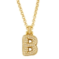 Macro shot of gold-plated letter B pendant necklace with pavé-set shimmering crystals - Letter B