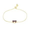 Detail of adjustable gold bear bracelet with ruby-colored micro-pave crystals - Fuschia