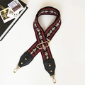 Close-up of adjustable ethnic pattern wide strap with gold metal swivel hooks - Ethnic Style with Black Leather