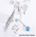 Silver feather metal bookmark with a lake blue baby's breath dried flower glass ball - Lake Blue Gypsophila