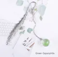 Silver metal feather bookmark featuring a clear glass globe with green dried flowers - Green Gypsophila