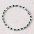Detail of silver tennis bracelet with alternating green and white cubic zirconia stones - Green Bracelet-Platinum
