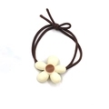 Detail view of coffee brown elastic hair tie with cream resin flower ornament - Hair Tie / White Flower