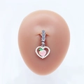 Macro detail of heart-shaped belly ring with peach center and pearl inlay on model - Pearl Heart Peach