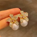 Sparkling lily flower stud earrings with gold plating, zircons and white pearls - E1290-Gold Pearl Lily Flower