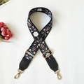 Detail of floral ethnic embroidery on black wide bag strap with gold metal buckle - Black White Floral + Black Leather (Silver Hook)