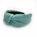 Detailed view of turquoise satin headband featuring premium silk texture and center knot - Light Blue