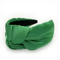 Solid green satin knotted wide headband with vintage silk texture on white background - Green