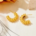 Detailed view of gold C-shaped chunky hoop earrings with a textured croissant pattern - Threaded Style (23991)