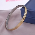 Brazalete de acero inoxidable de tres capas en oro y plata con cierre de bisagra - Bicolor Oro y Plata