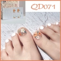 Detail of QD071 floral nail stickers applied on toes with minimalist white polish accent - Transparent Base Small Flower (QD71)