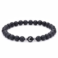 Black 6mm lava stone beaded bracelet featuring a white letter C charm and silver spacers - Letter C