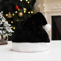 Classic black plush Christmas hat with white pompom in festive background - Black