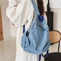 Stylish blue denim backpack for women featuring durable woven shoulder straps - One Size / Light Blue