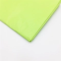 Close-up of green tissue paper showing premium texture for floral gift wrapping - Fruit Green