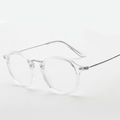 Gafas redondas retro con montura transparente y patillas de metal plateado, estilo minimalista - Marco Transparente