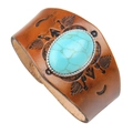 Close-up of brown leather wristband with oval turquoise inlay and embossed arrows - Brown