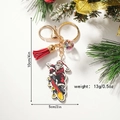Portachiavi Babbo Natale su skateboard con nappa rossa e palla con stelle colorate - Babbo Natale sullo skateboard