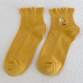 Ginger yellow cotton knit socks featuring white flower embroidery and ruffled lettuce edges - Yellow