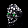 Detailed view of gothic skull ring with green gemstone eyes and vintage silver finish - Green Eye Skull