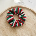 Close-up of red and green striped knit scrunchie on a beige speckled tray - Knitted Scrunchie / Christmas Color Stripe