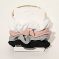 Set of four ribbed fabric scrunchies in white, pink, grey and black on display card - Ribbed Knit White Pink Grey Black 4-Pack