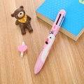 Pink flamingo multi-color ballpoint pen with cartoon graphics on a wooden desk - Flamingo - Pink / 6-Color Ballpoint Pen