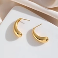 Minimalist 24k gold plated teardrop earrings with a polished finish on silk background - 24K Gold Plated / Gold