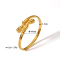 Detail view of Pharaoh gold bangle showing 68mm diameter and 5.5mm width dimensions - Style 2 (Portrait Relief)