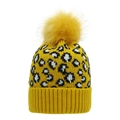 Detail of yellow leopard print knit beanie featuring a large faux fur pompom and ribbed cuff - Yellow