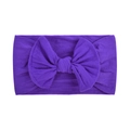 Detail of soft purple nylon baby headband featuring a large knitted bow on a white background - Purple