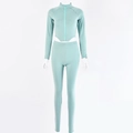 Detail of mint green two-piece tracksuit featuring a zipper top and high-waist leggings - S / Green