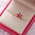 Macro detail of rose gold flower ring with pink crystals and zircon in a red gift box - 3#14116A (Rose Gold Red Gem Floral)