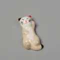 Detail view of a ceramic cat chopstick rest with hand-painted patterns, size 5.5x2.5x1.5cm - 5.5*2.5*1.5cm / Style F