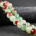 Polished 10mm round jade beads in green with red spotted texture for DIY jewelry - Red Green Flower
