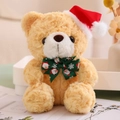 Close-up of a brown teddy bear wearing a red Christmas hat and green festive bowtie - Green Bow Tie Style (Light Brown Bear)