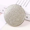 Portable round folding makeup mirror in sparkling gold sequin finish on a book - Champagne-colored Round 60mm♜