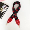 Detail of adjustable woven bag strap featuring red hearts and gold metal swivel clasps - Heart Pattern Red Leather