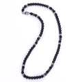Matte black stone beaded necklace with silver accents and lobster clasp on white background - Black Magnetite + Matte Stone Necklace