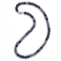 Macro detail of 8mm tiger eye bead necklace with volcano stone and silver lobster clasp - African Turquoise Necklace