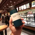 Mini 150ml dark cyan vacuum insulated water bottle held in hand showing compact pocket size - 150ML / Dark Blue
