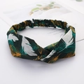 Cross-over fabric headband in dark green with white and gold feather patterns for women - Feather Style 2 Green