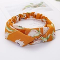 Bright orange floral twist headband with cross knot design and comfortable elastic back - Style 65 Orange Floral