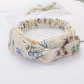 Beige floral twisted headband for women with blue and brown patterns on white background - Style 68 Beige Floral