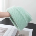 Detail of mint green fuzzy knit hat showing long plush texture and mohair material - Stretchy / Light Green